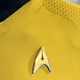 A yellow Starfleet uniform from Star Trek: Strange New Worlds.